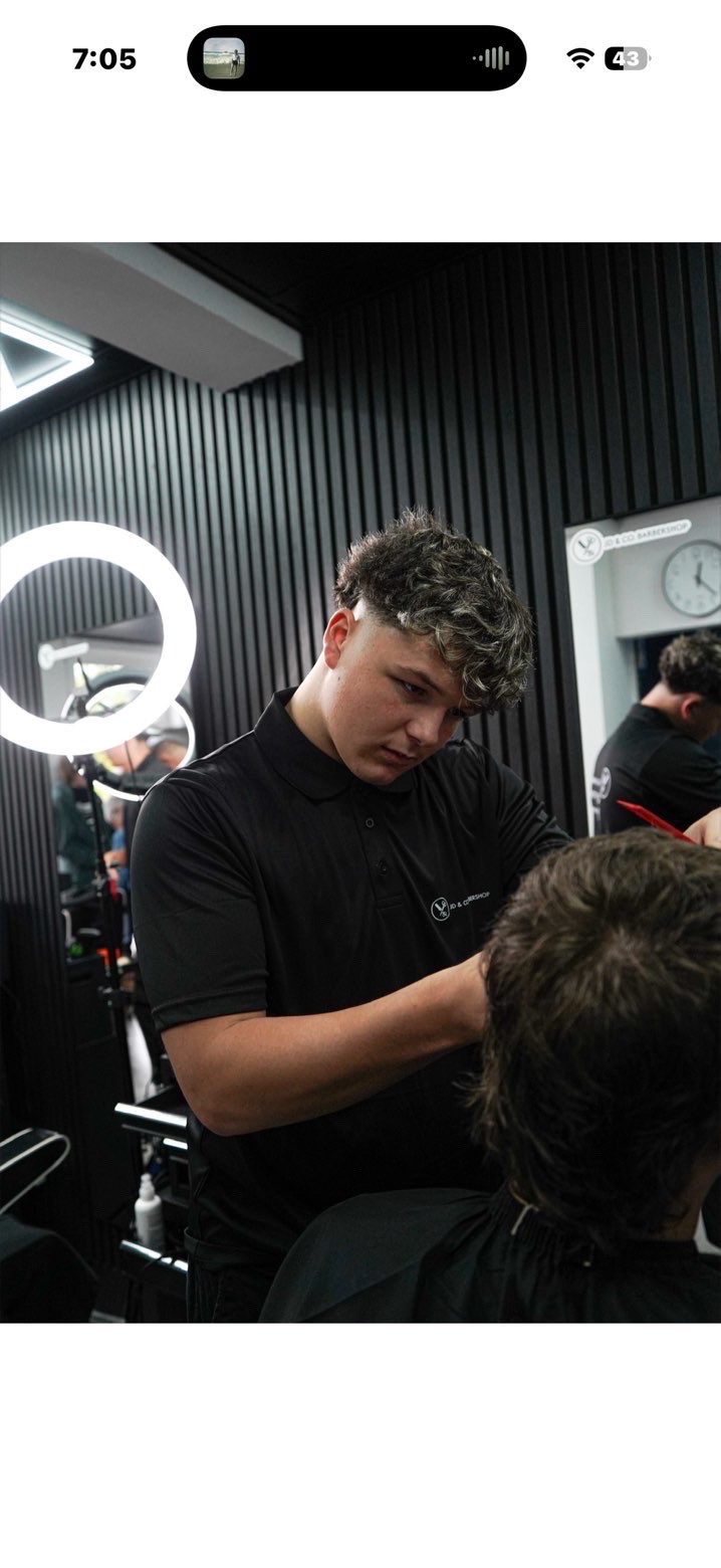 Declan McCall cutting hair at JD&Co Barbershop